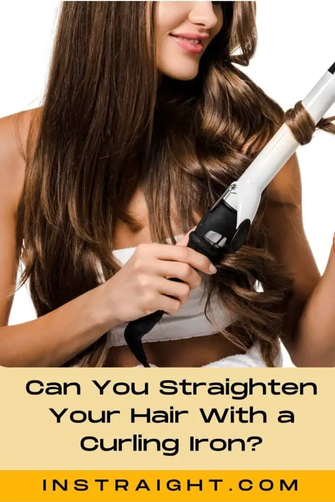 lady curling her hair using a curling iron