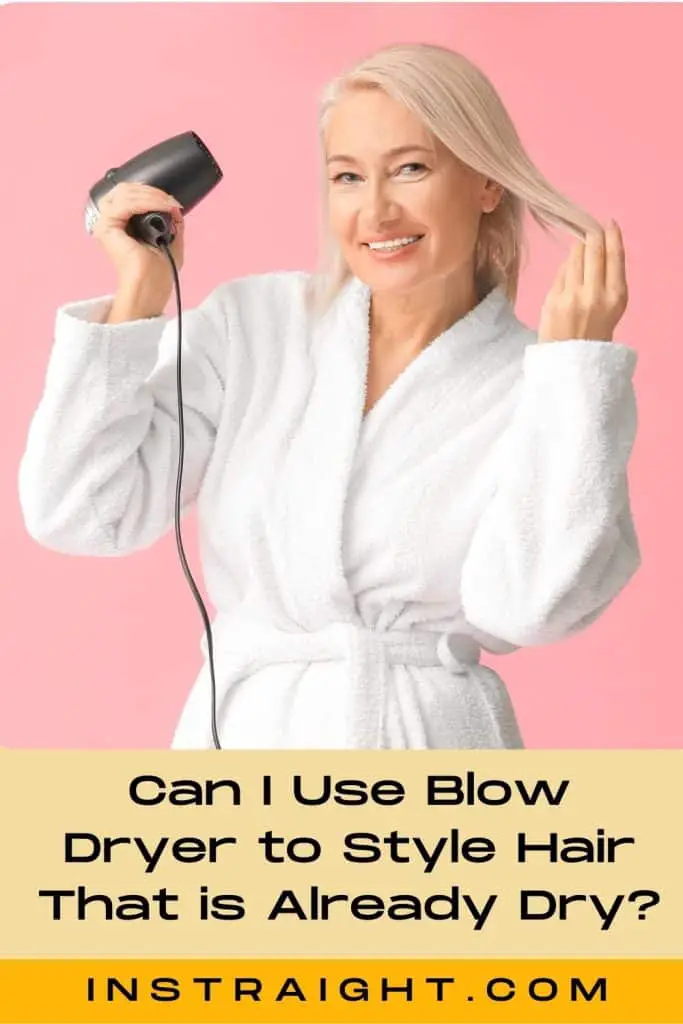 pretty woman blow drying her hair
