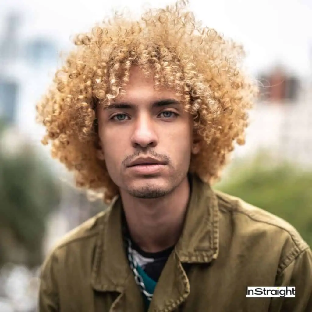 A picture of a male with nice curly hair after blowing
