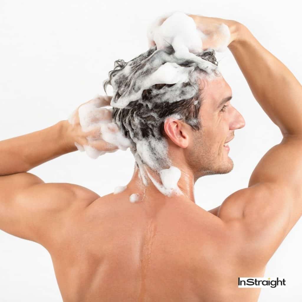 man washing his hair thoroughly