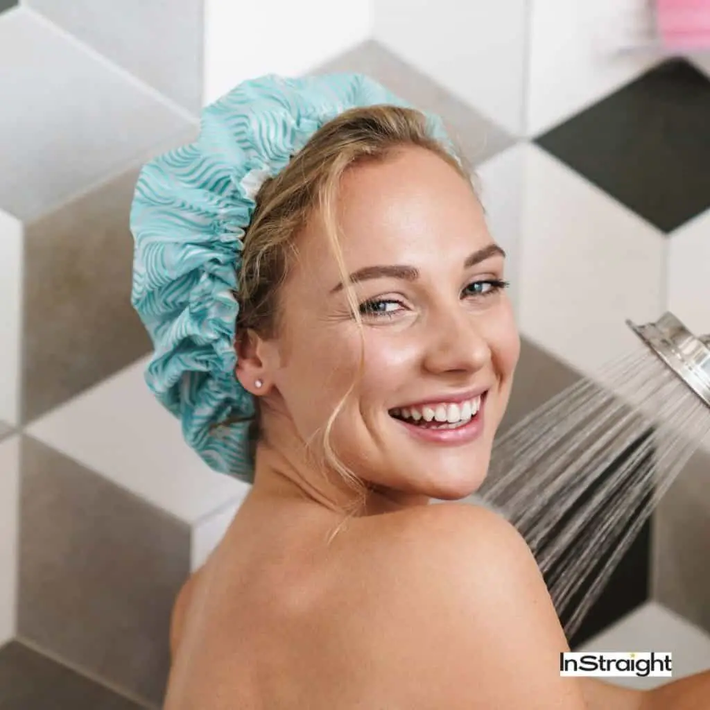 lady showering with a shower cap on