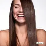 happy lady after doing brazilian blowout at home