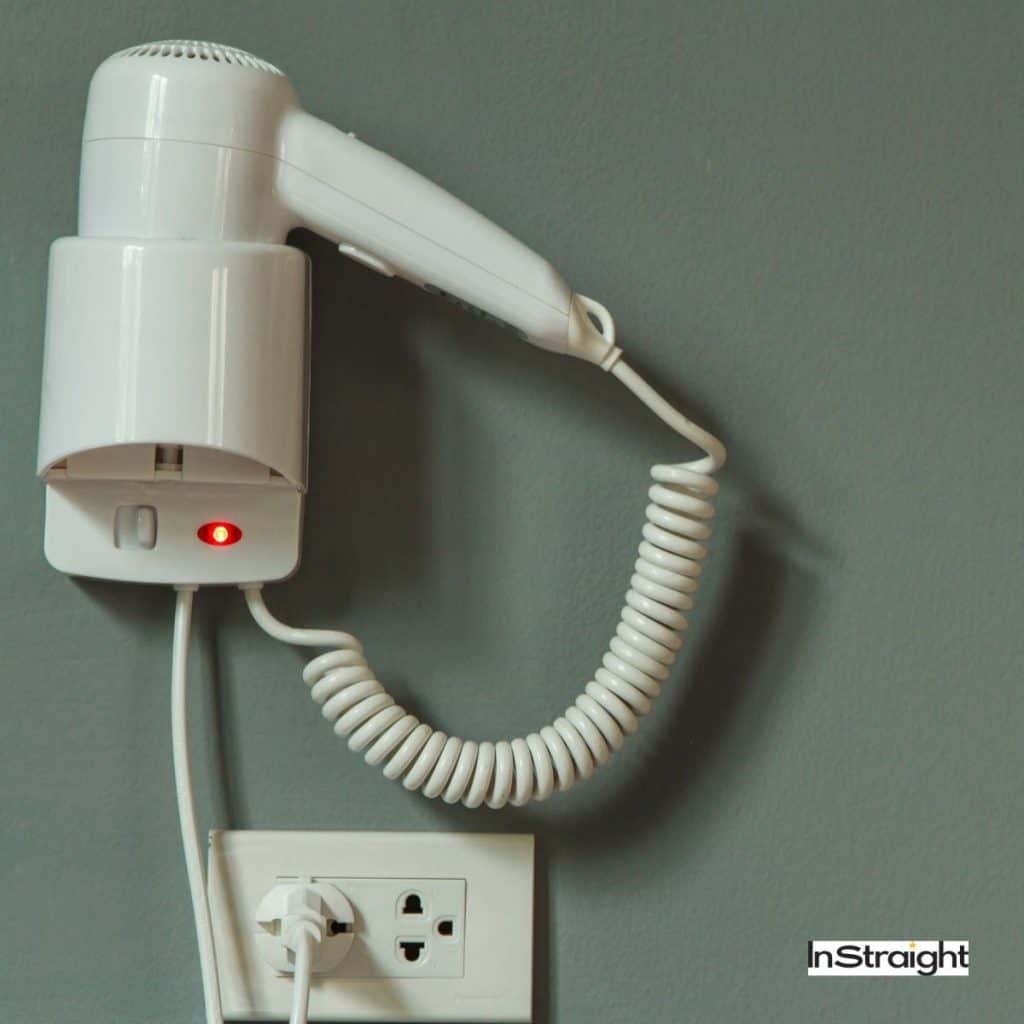 plugged hairdryer on the wall (Can You Use A Hairdryer After It Gets Wet )