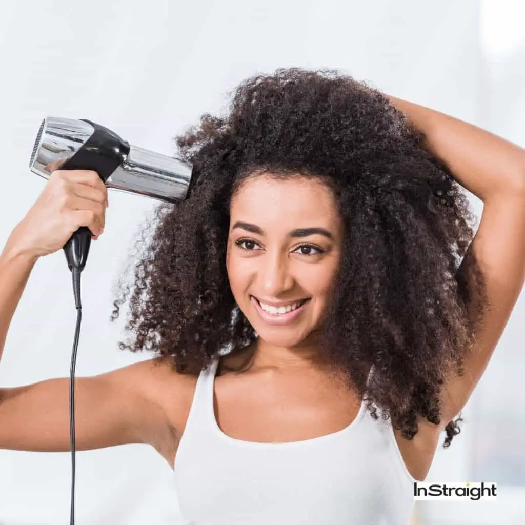 pretty lady showing how to blow dry curly hair without a diffuser