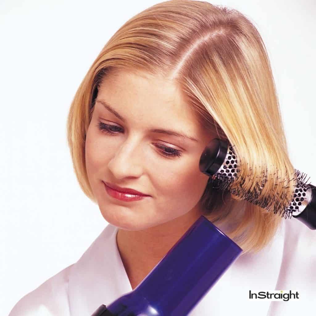 blonde lady showing how to blow dry a bob