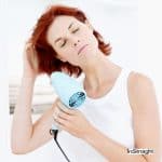 lady showing how to blow dry a bob for medium length