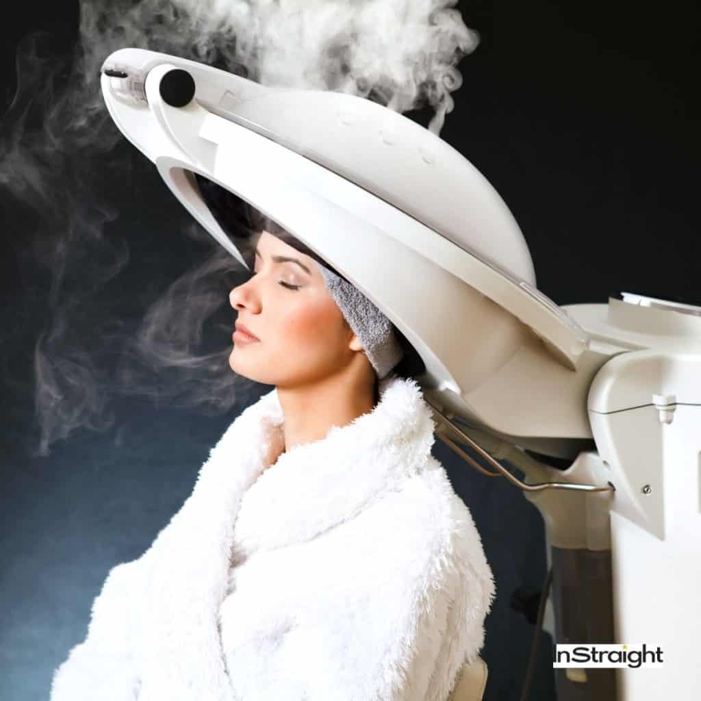 lady having a steam treatment but what are the benefits of steaming hair?