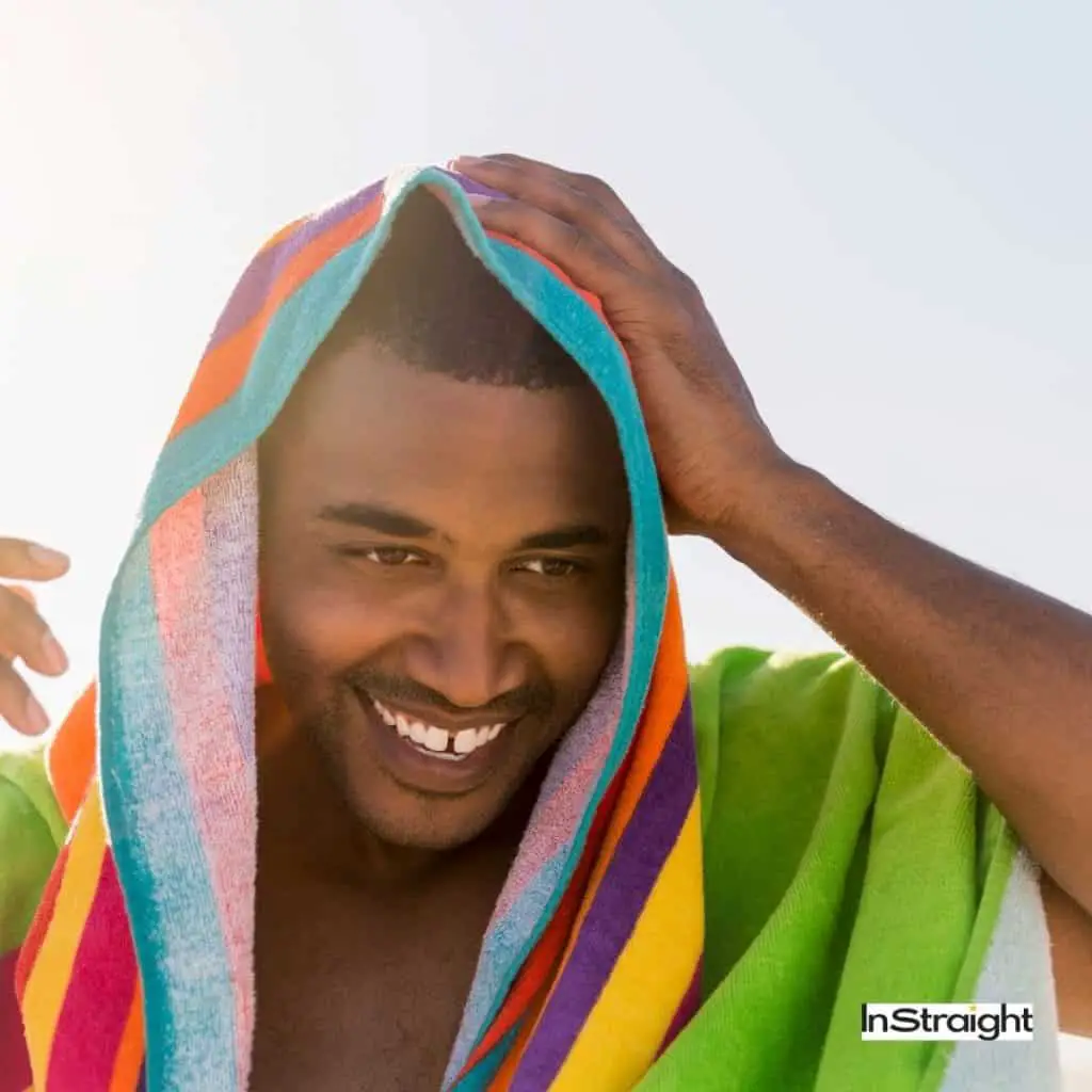 Man towel drying hair with a colorful towel under title How To Towel Dry Men Hair