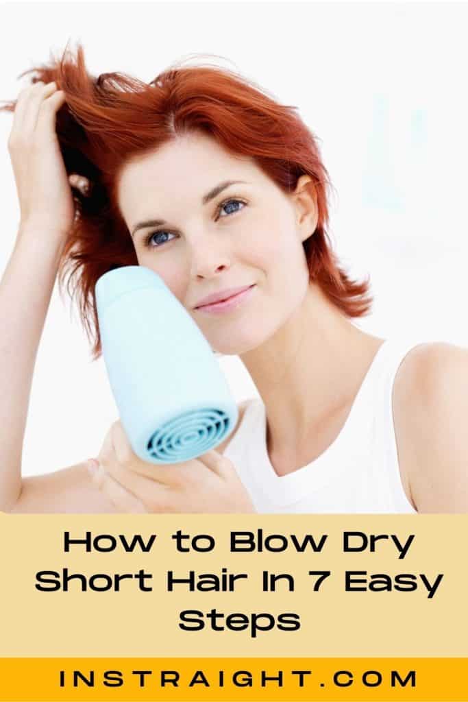 red-haired lady blow drying her hair