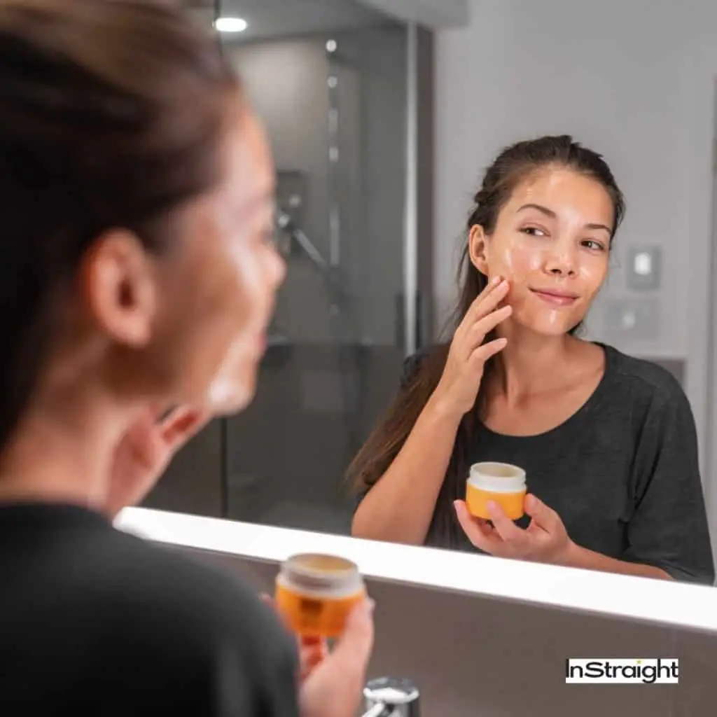Lady applying oil on face infront of LED mirror under title Are LED Makeup Mirrors Bad For Your Eyes?