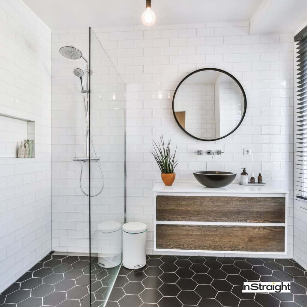 bathroom with a round mirror