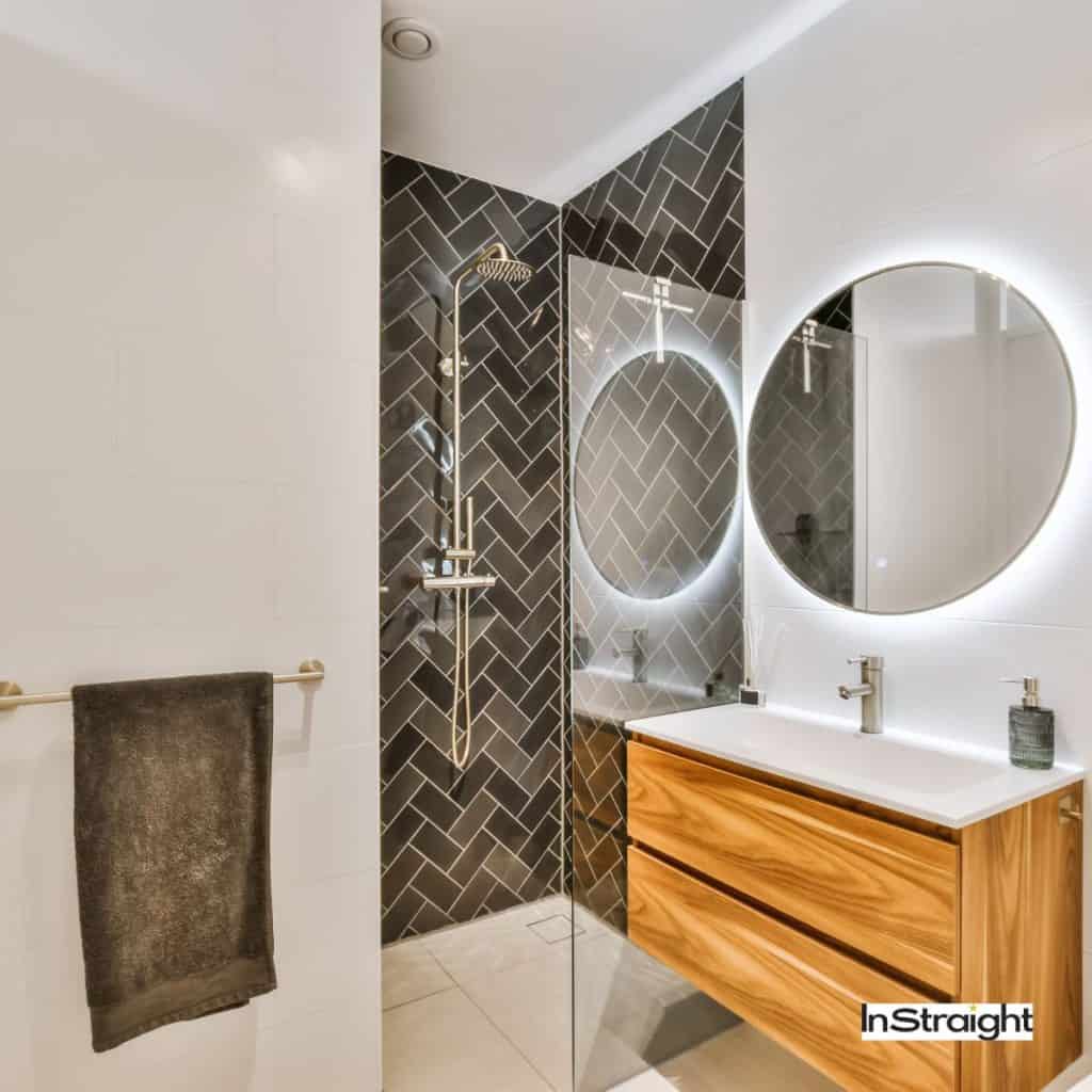 round mirrors under title are large bathroom mirrors out of style?
