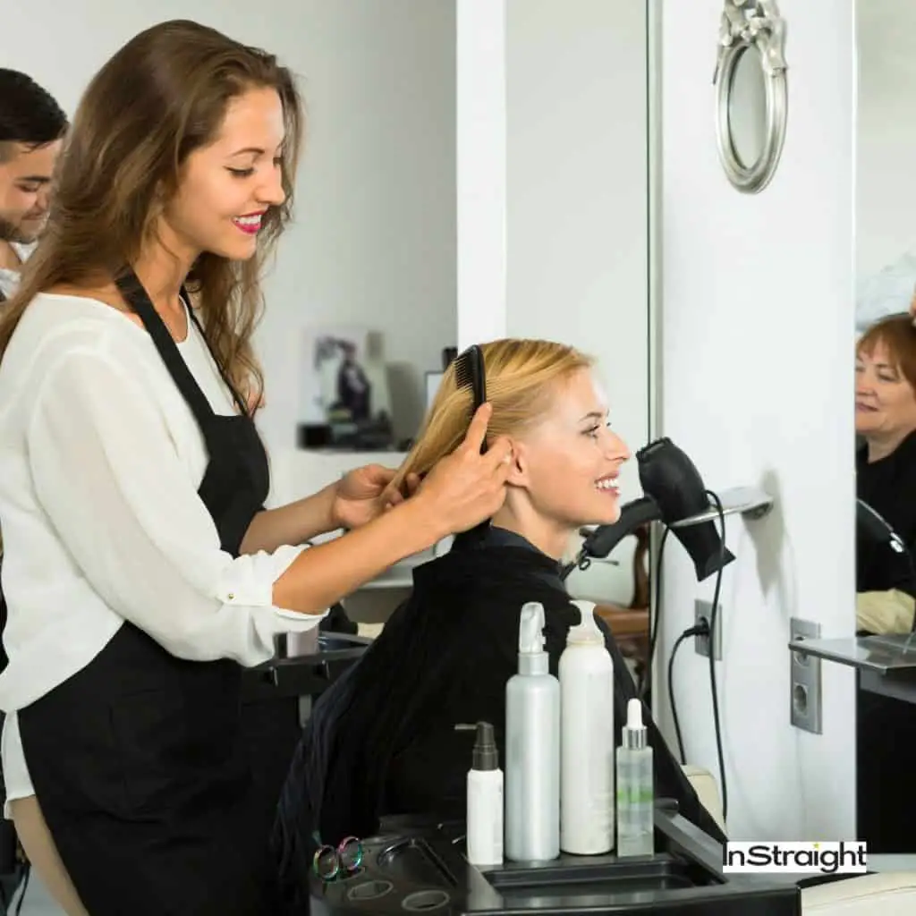 A lady getting hair treatment at a salon 