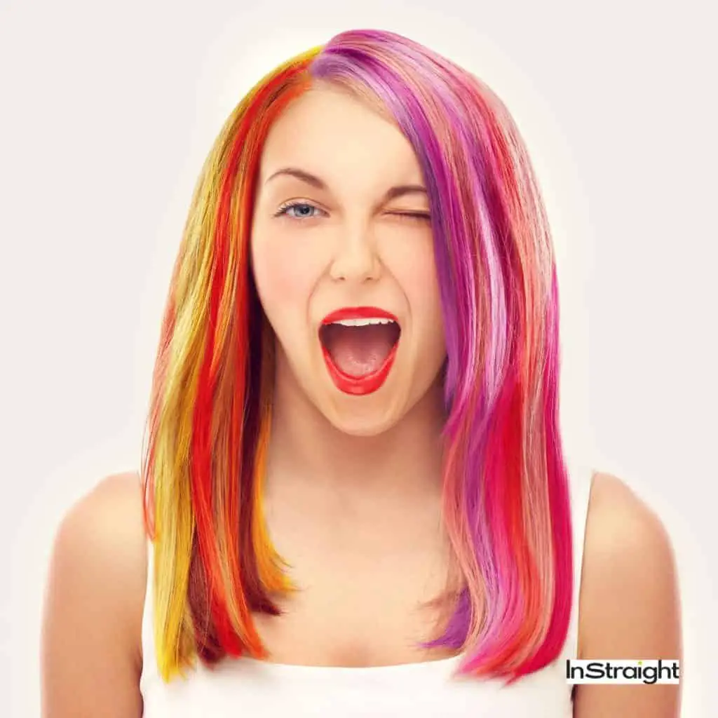 A lady with colorful hair under tilte dying hair after A keratin treatment