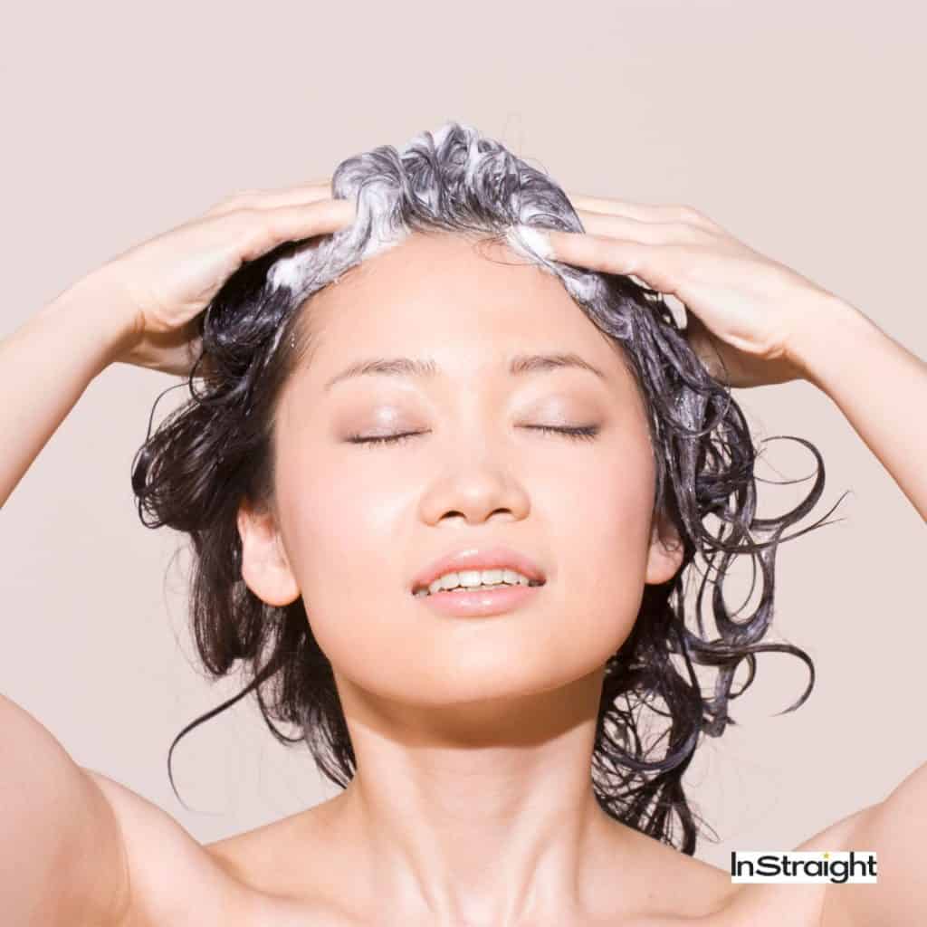 An Asian lady getting hair washed