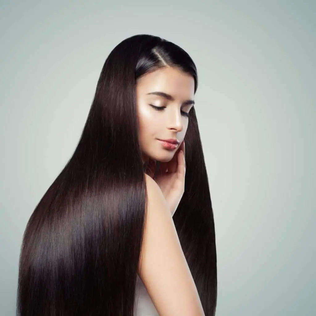 A lady with glossy straight hair under title how to sleep with keratin-treated hair