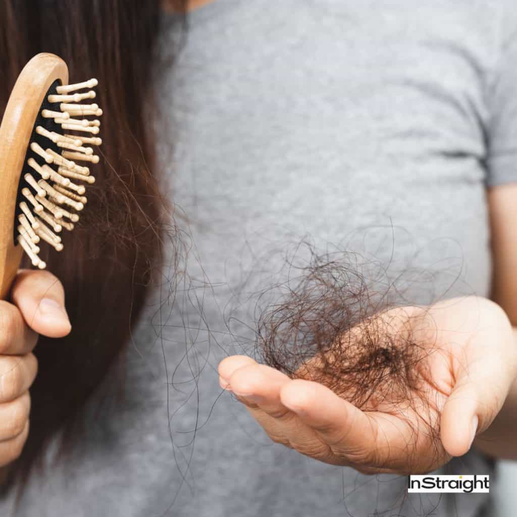 A lady holding a hair brush with a lot of hair shedding under title How Do I Know If My Scalp Is Damaged?