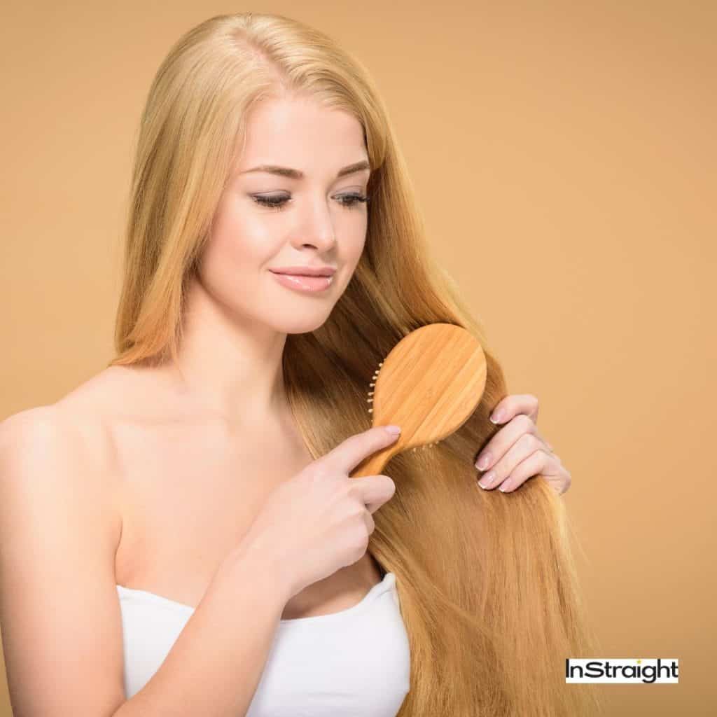 brushing long blonde hair 