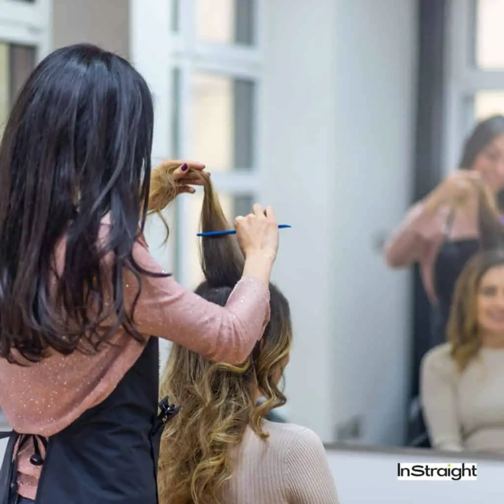 A client with a stylist in a salon