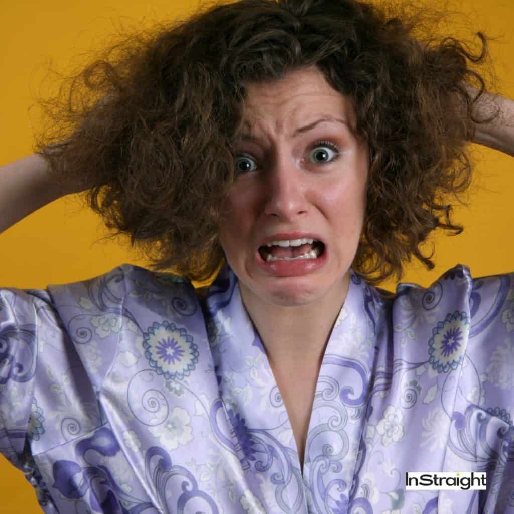 women with frizzy hair that is one of the signs of heat damaged hair