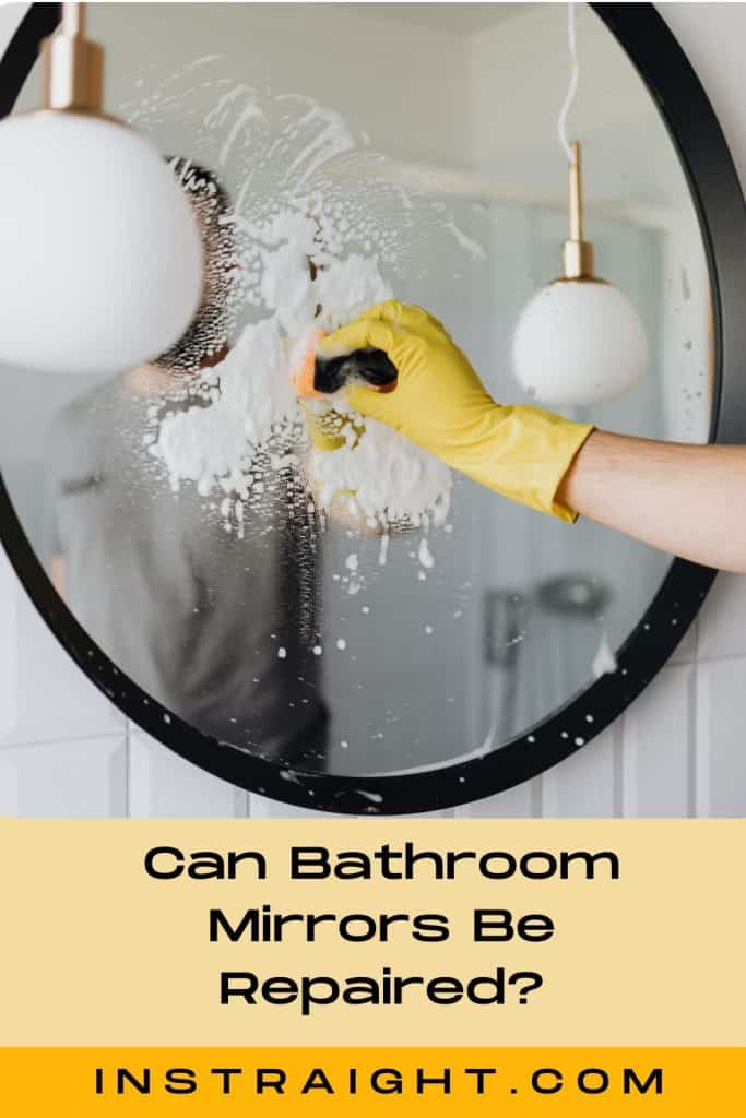cleaning a bathroom mirror